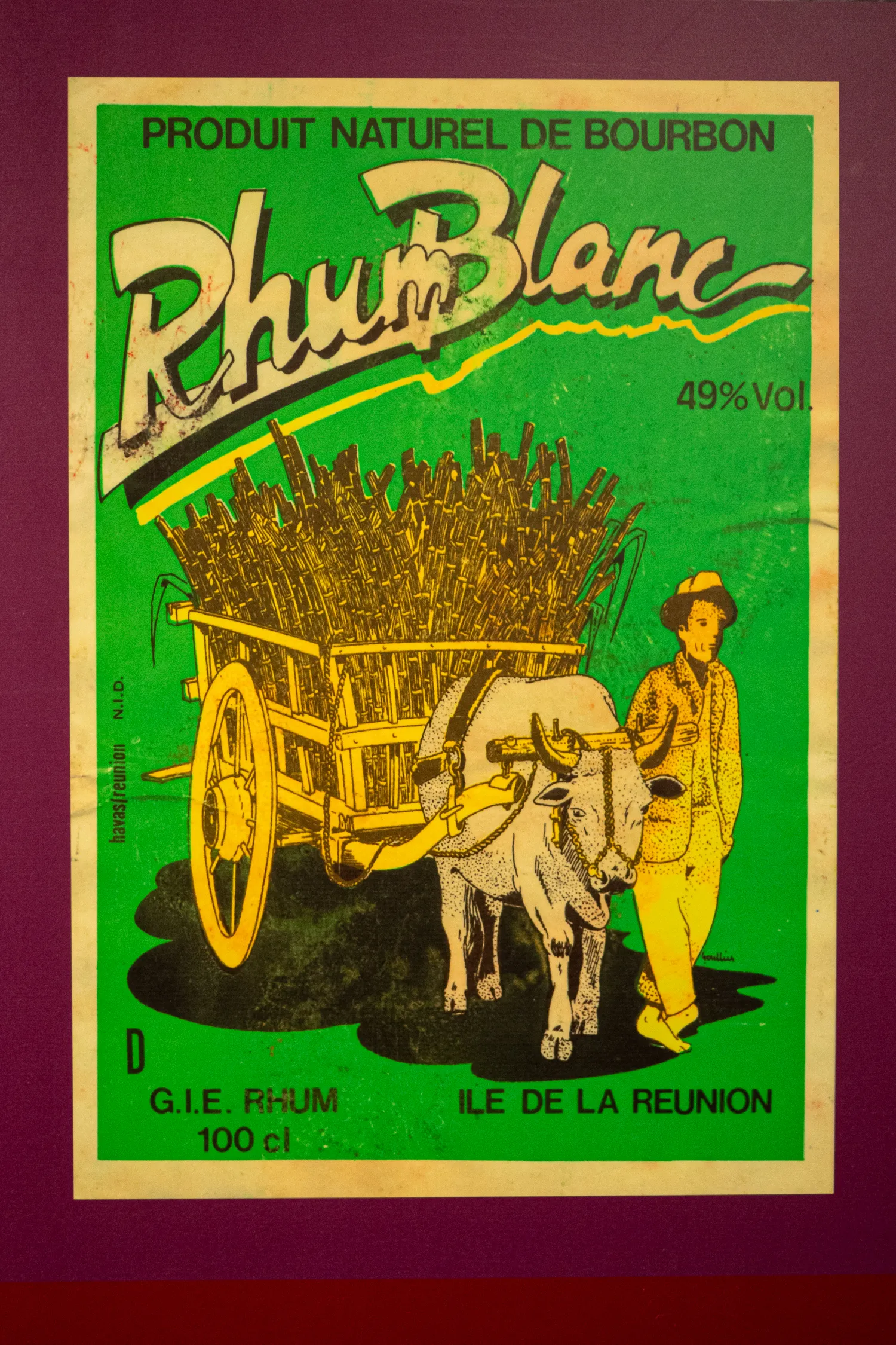 Vintage rhum poster with ox cart full of sugarcane on green background